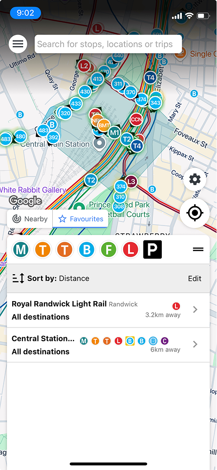 The AnyTrip app showing live vehicles on a map around Central Station, Sydney, with a nearby-stops list.