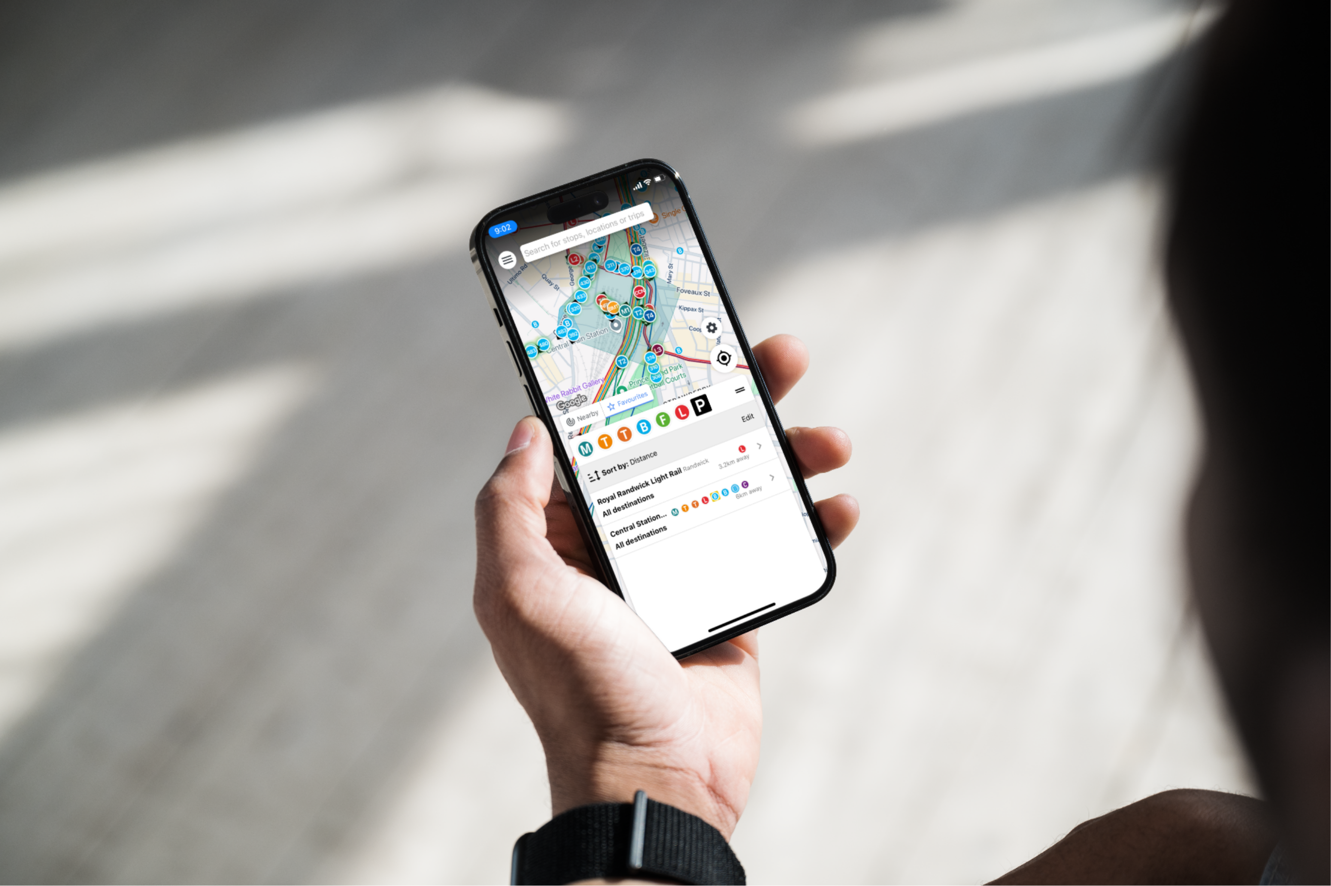 A commuter checking live departures around Central Station in the AnyTrip app.